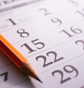 Close-up of a pencil on the page of a calendar